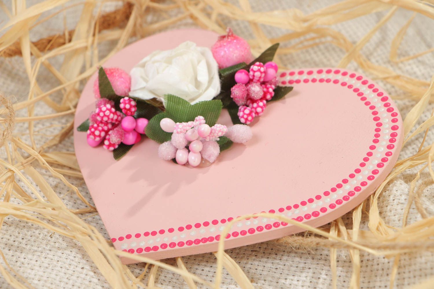Handmade souvenir heart-shaped wooden fridge magnet of pink color with flowers photo 1