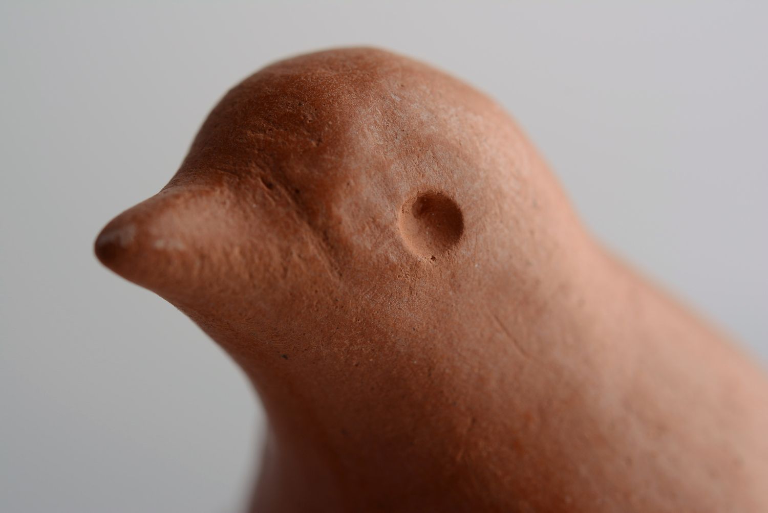 Clay penny whistle in the shape of a bird photo 3