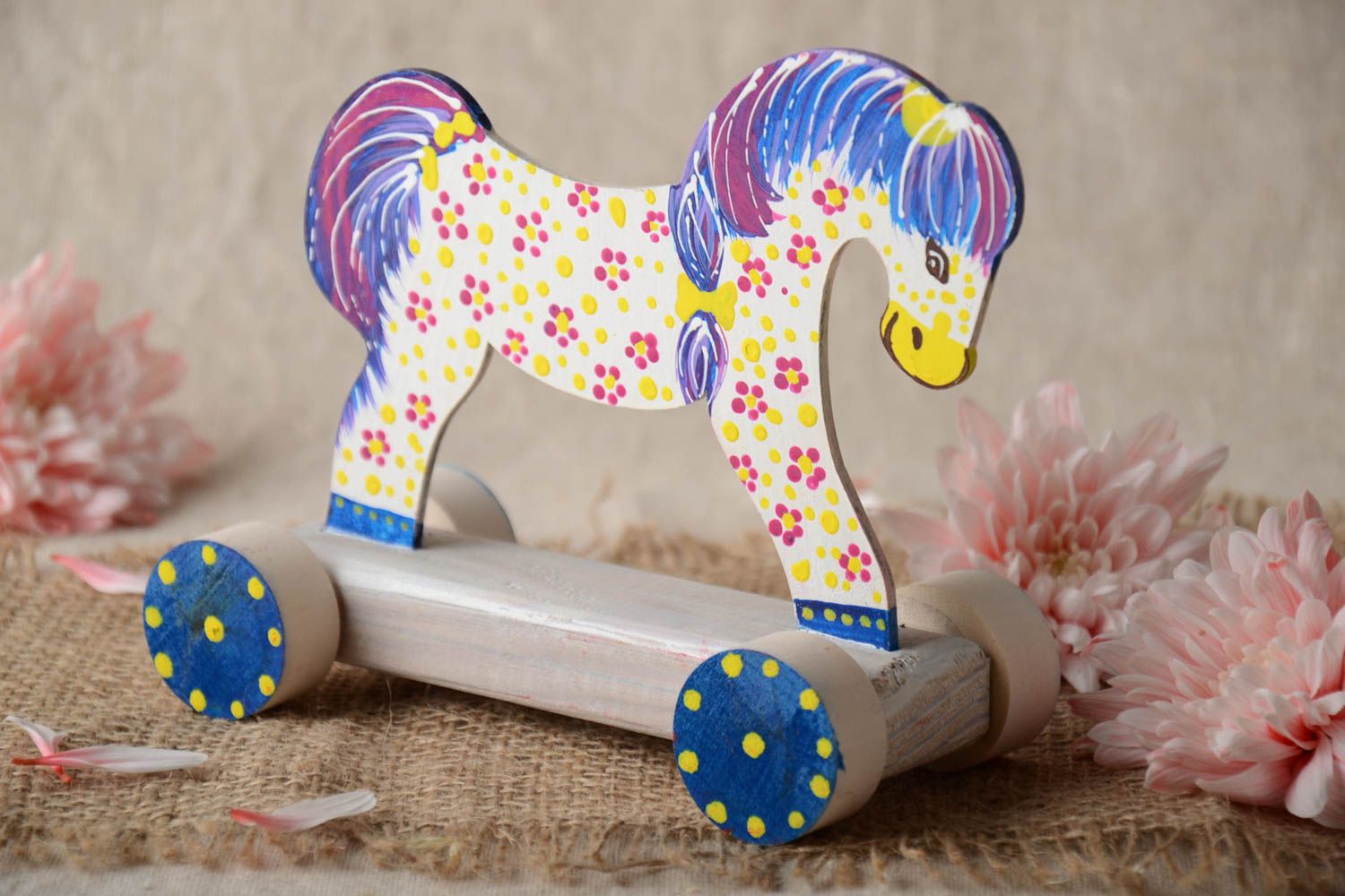 Bright painted handmade wooden wheeled toy of light color Horse for children photo 5