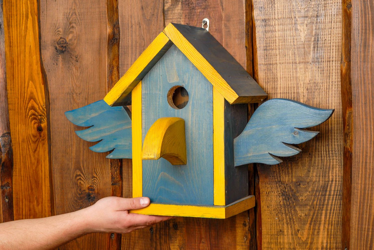 Wooden birdhouse painted with facade dyes photo 2