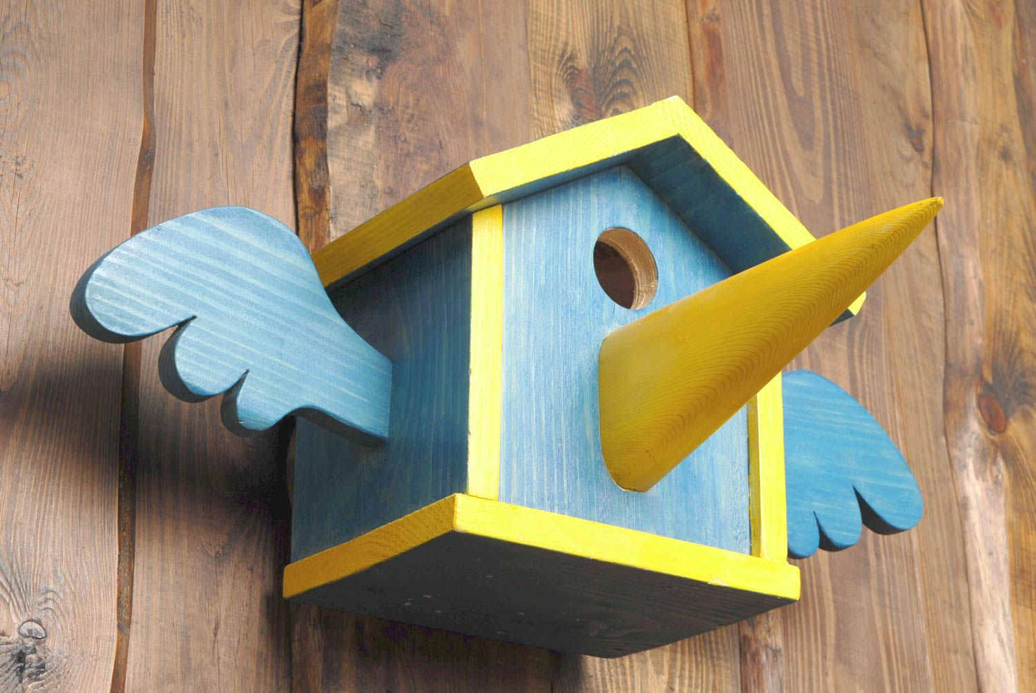 Painted wooden birdhouse with nose photo 4