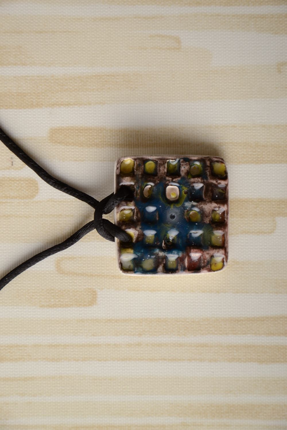 Ceramic pendant painted with enamels with cord photo 1