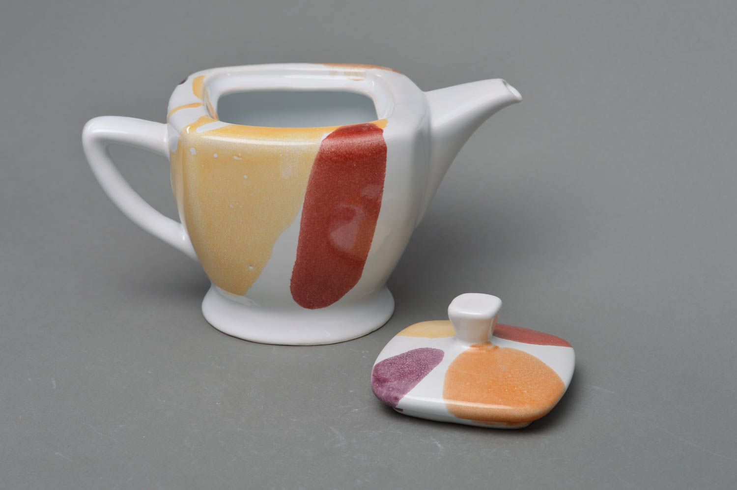 Square porcelain white tea kettle in red, yellow, and white color  photo 3
