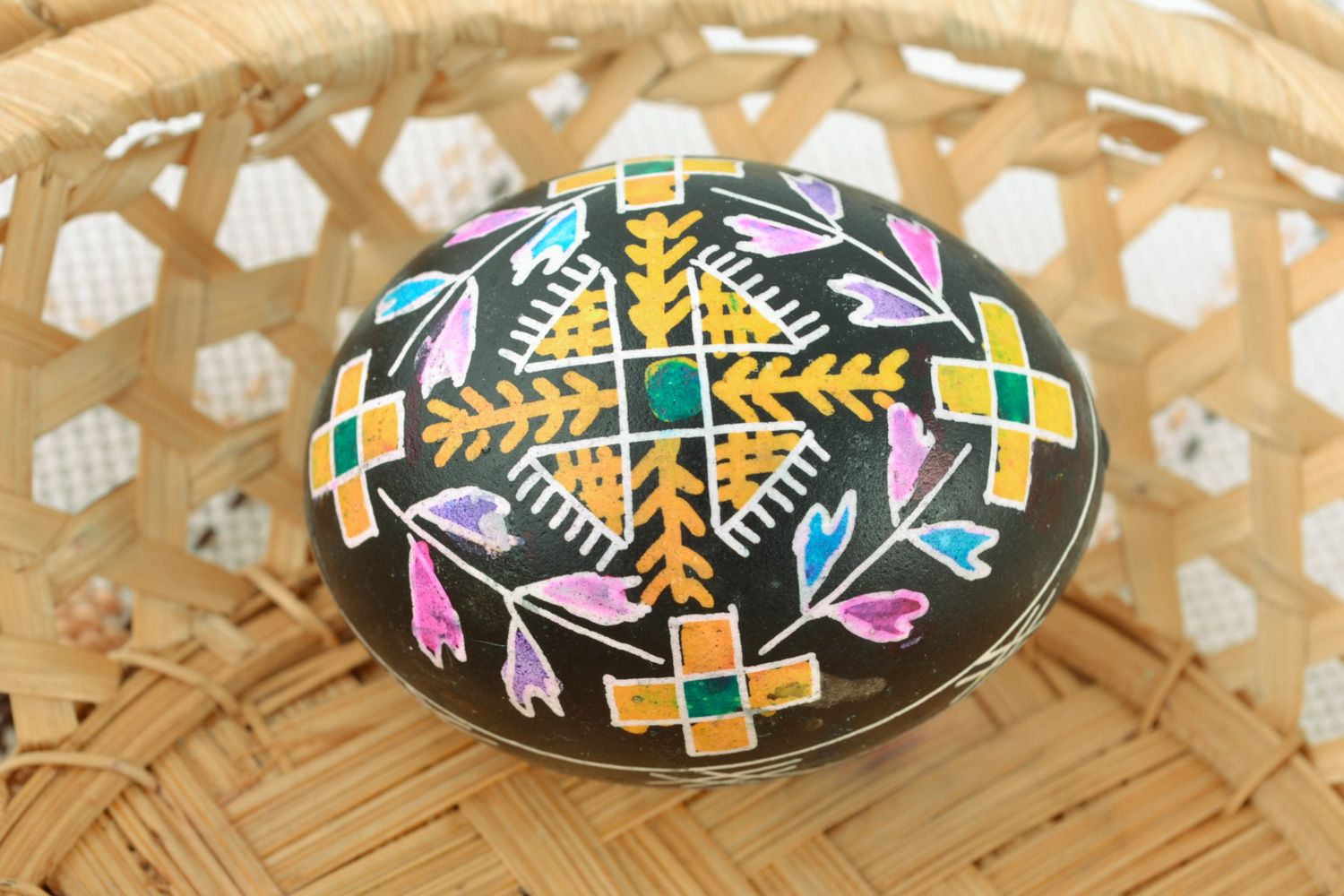 Handmade ornamented Easter egg painted using waxing technique photo 1
