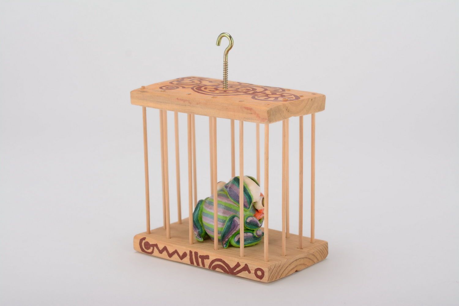 Grigri céramique verdoyant emprisonné dans une cage photo 4
