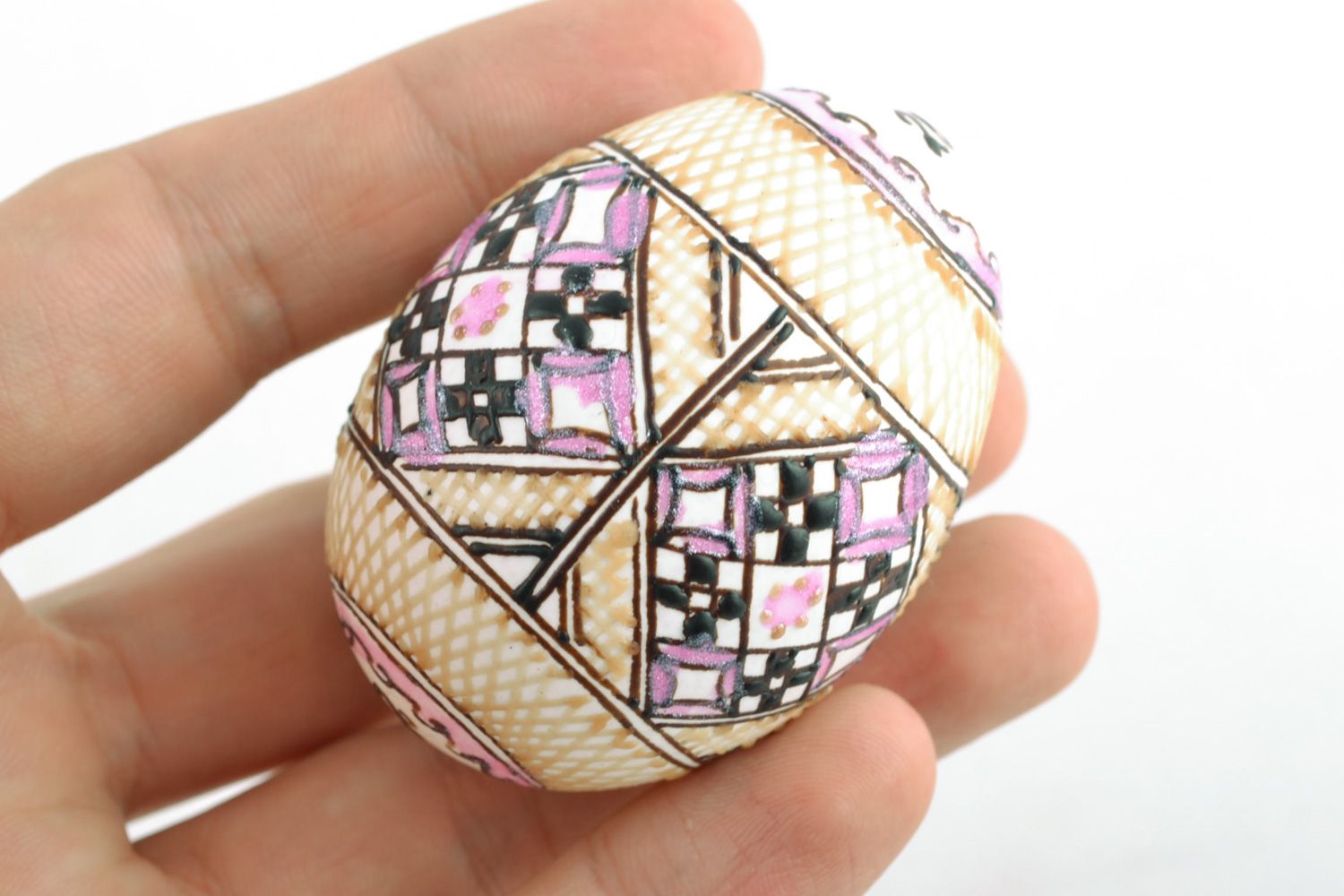 Handmade decorative Easter egg pysanka with wax painting in light color palette photo 2