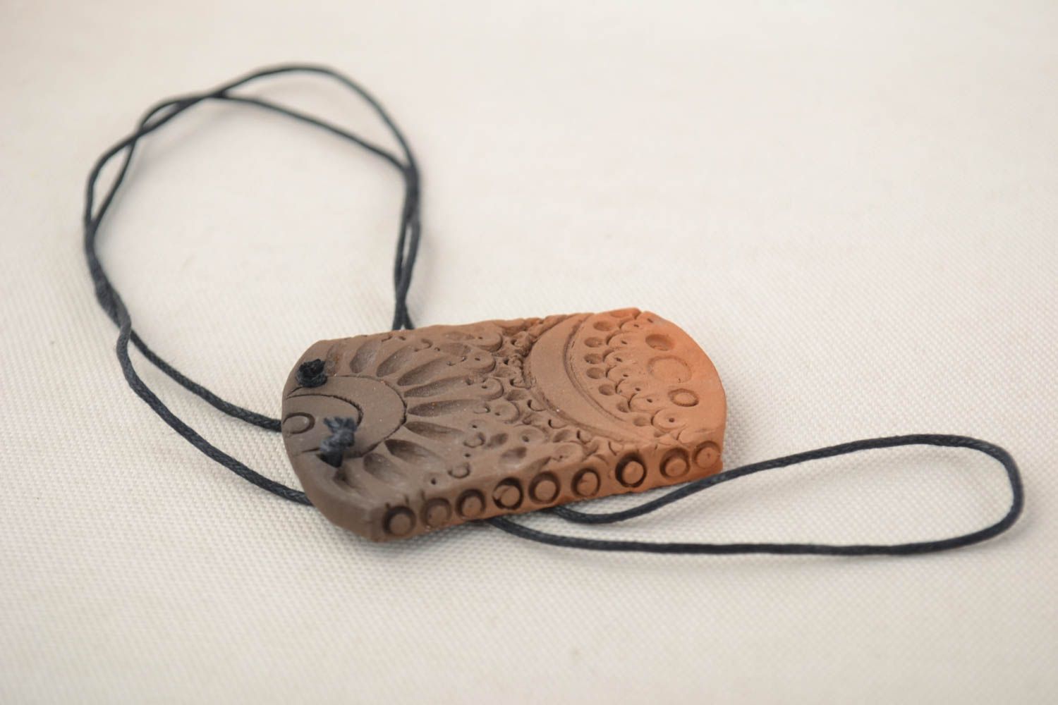 Beautiful unusual handmade long pendant made of red clay on lace photo 1