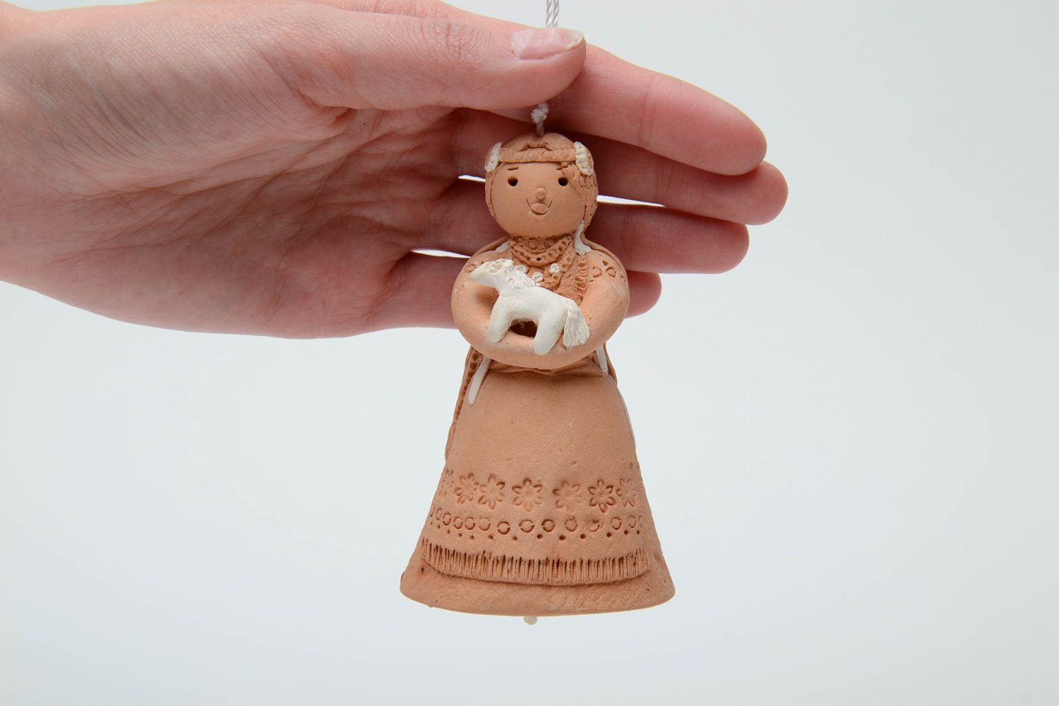 Figured clay bell with ornament photo 5