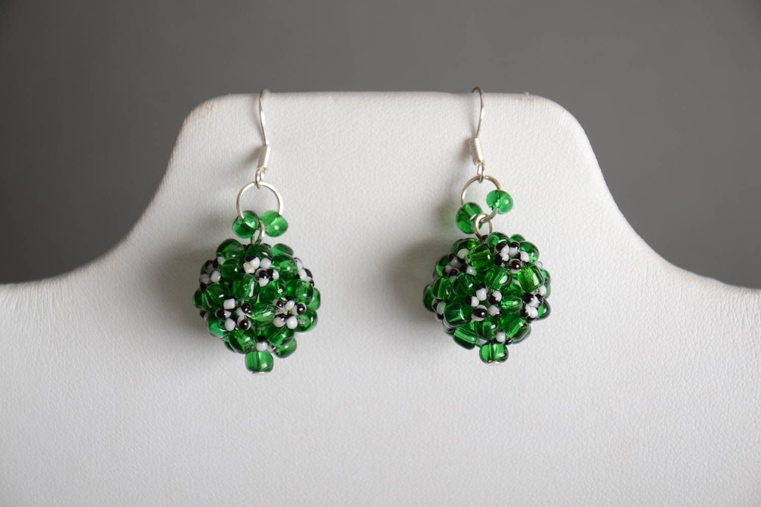 Handmade beautiful ball-shaped dangling earrings crocheted of green beads photo 1