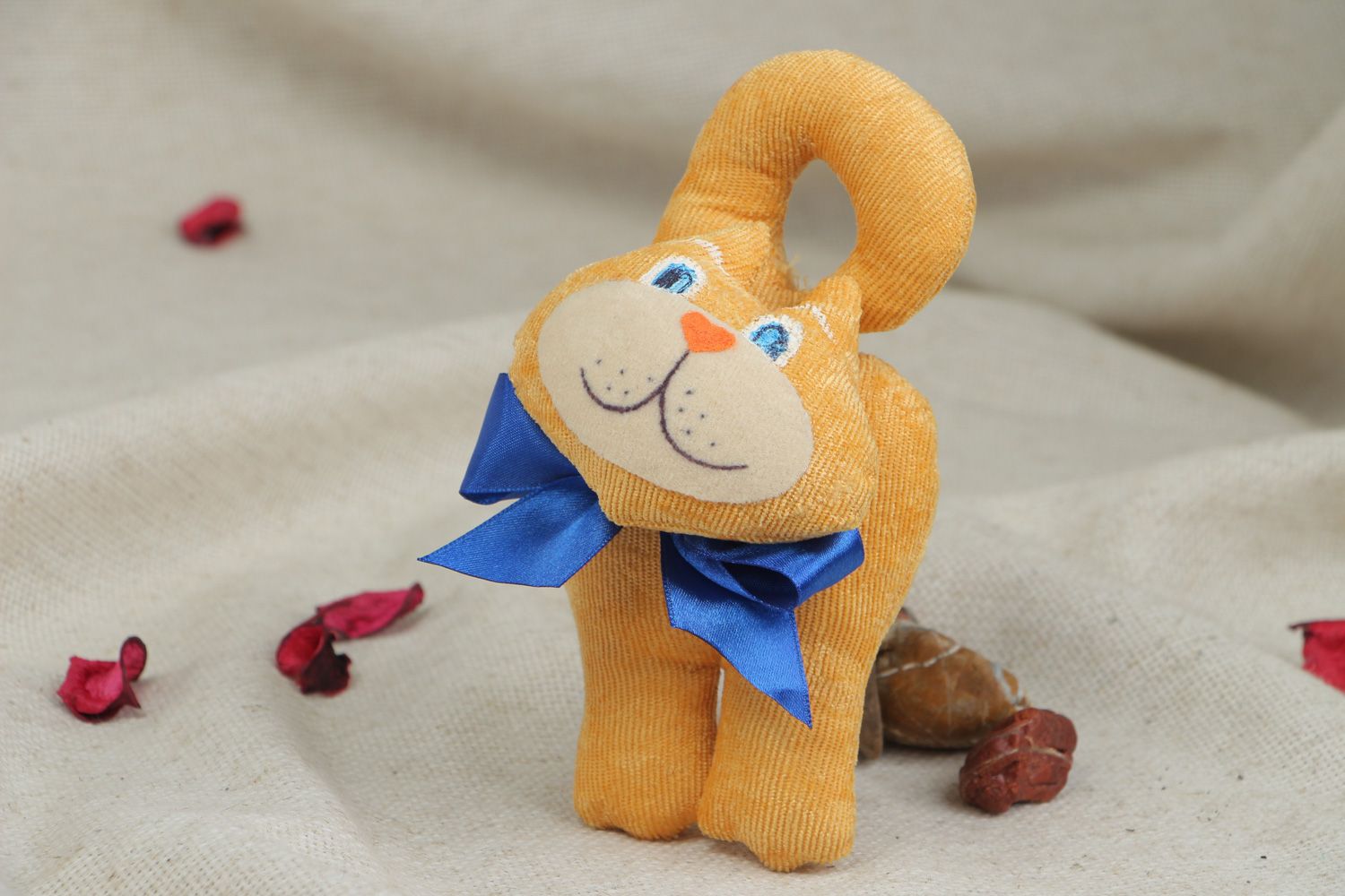 Cute handmade soft toy in the shape of yellow cat with blue bow for children photo 5