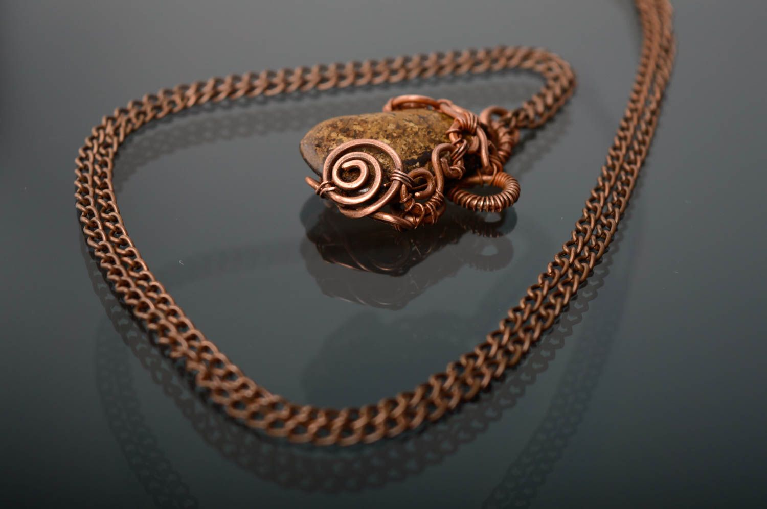 Copper pendant with natural bronzite stone photo 1