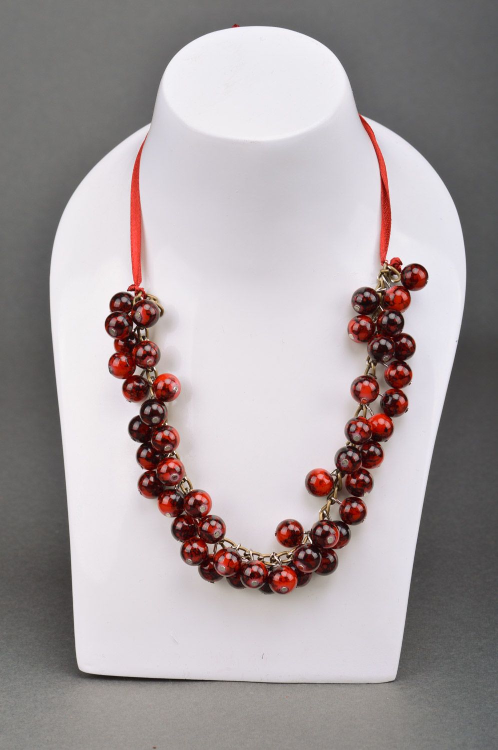 Handmade necklace woven of ceramic beads of saturated garnet color on ribbon photo 1