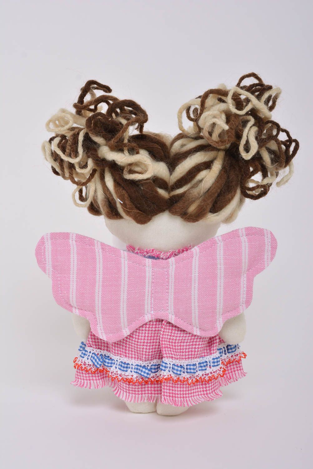 Beautiful small handmade fabric soft doll in pink dress for children photo 3