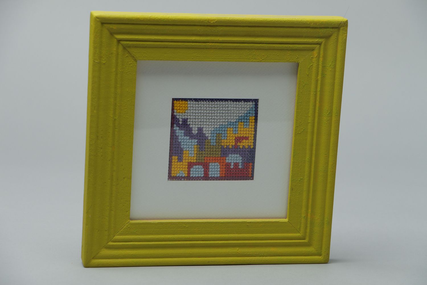 Handmade cross stitched painting in bright frame photo 1