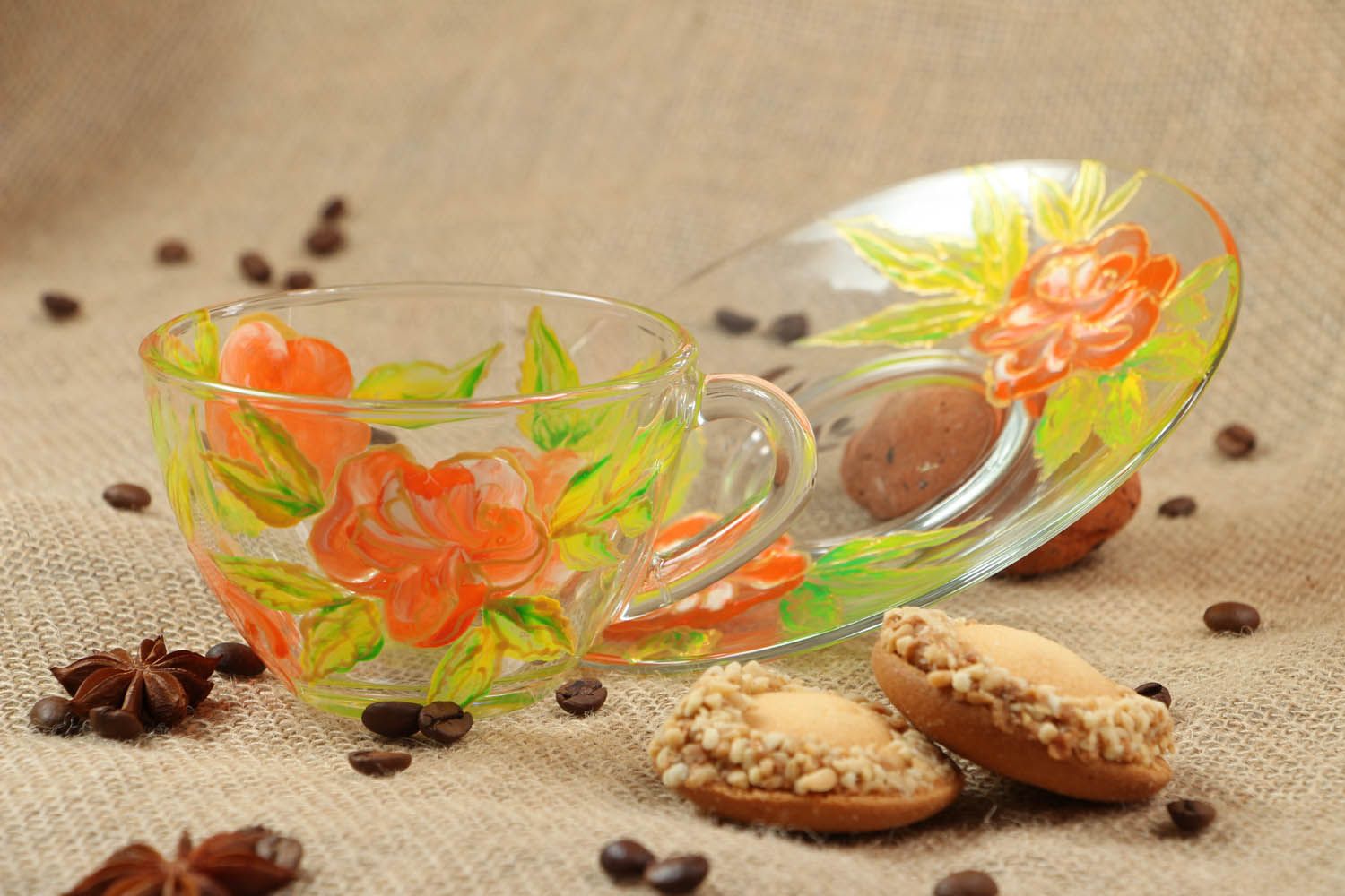 Clear glass tea cup with handle, saucer, and red and yellow flower pattern photo 5