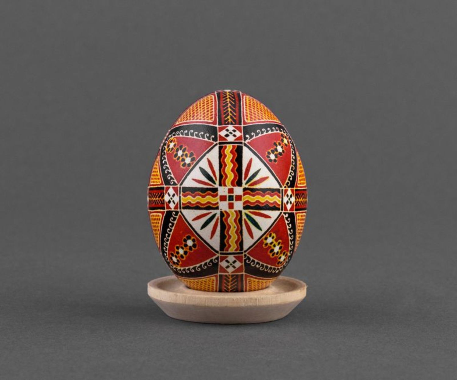 Painted Easter egg with colorful ornaments in ethnic style for present photo 3