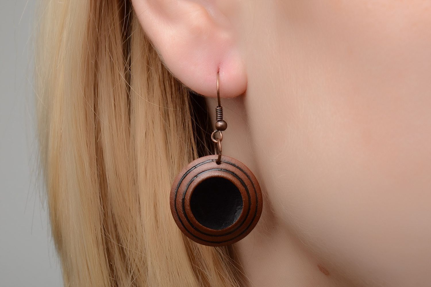 Handmade brown ceramic dangle earrings of round shape painted with enamels photo 2