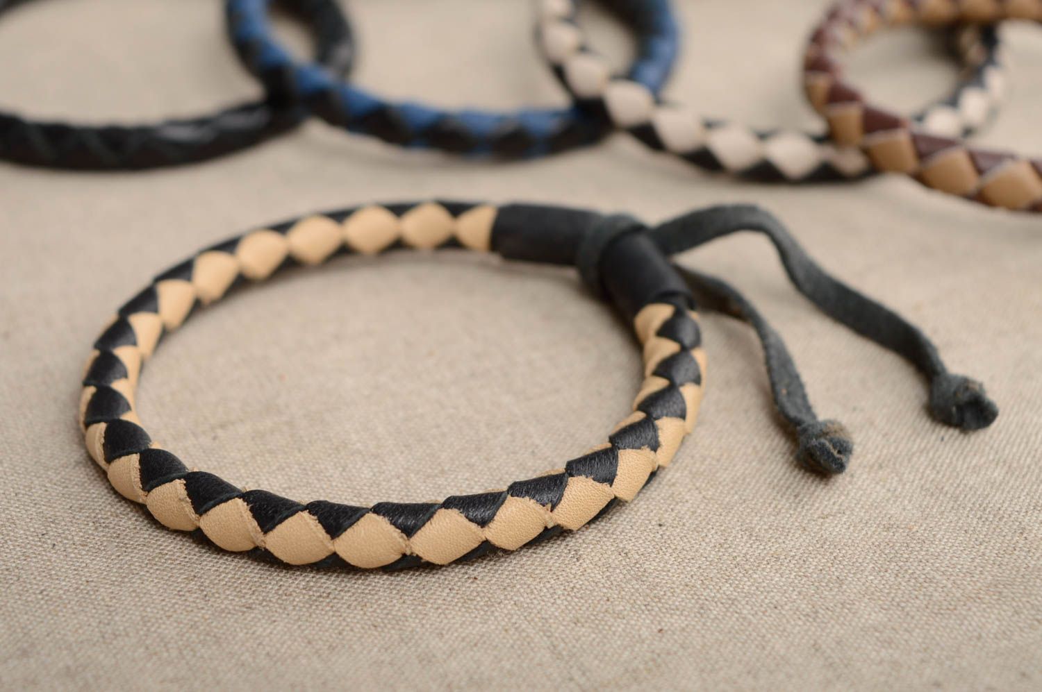 Thin woven leather bracelet with ties photo 1