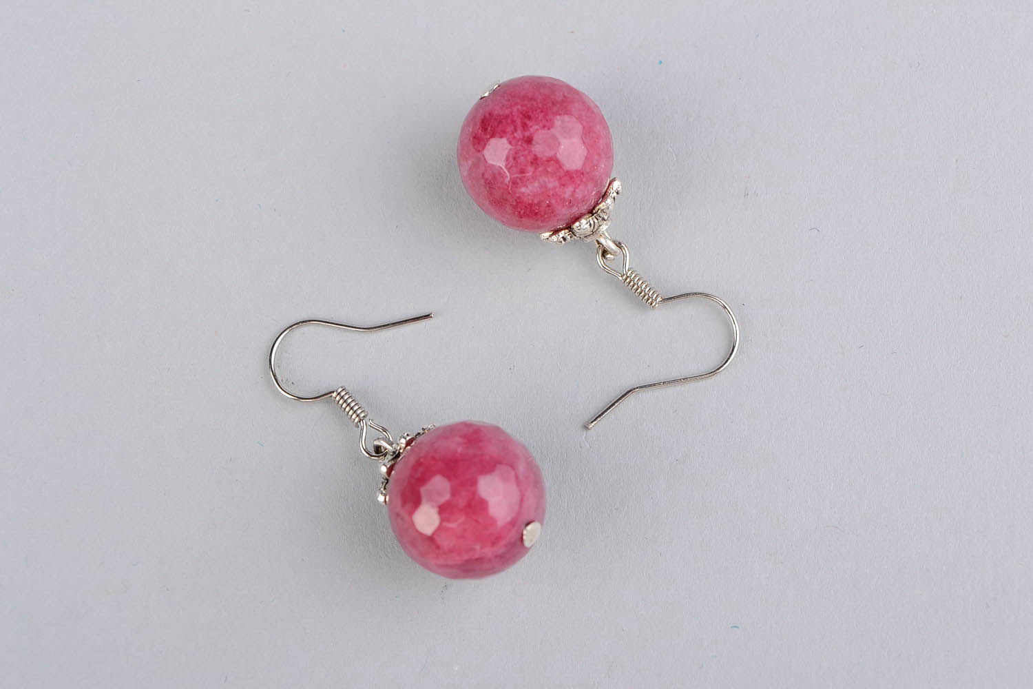 Ball earrings with a young ruby photo 3