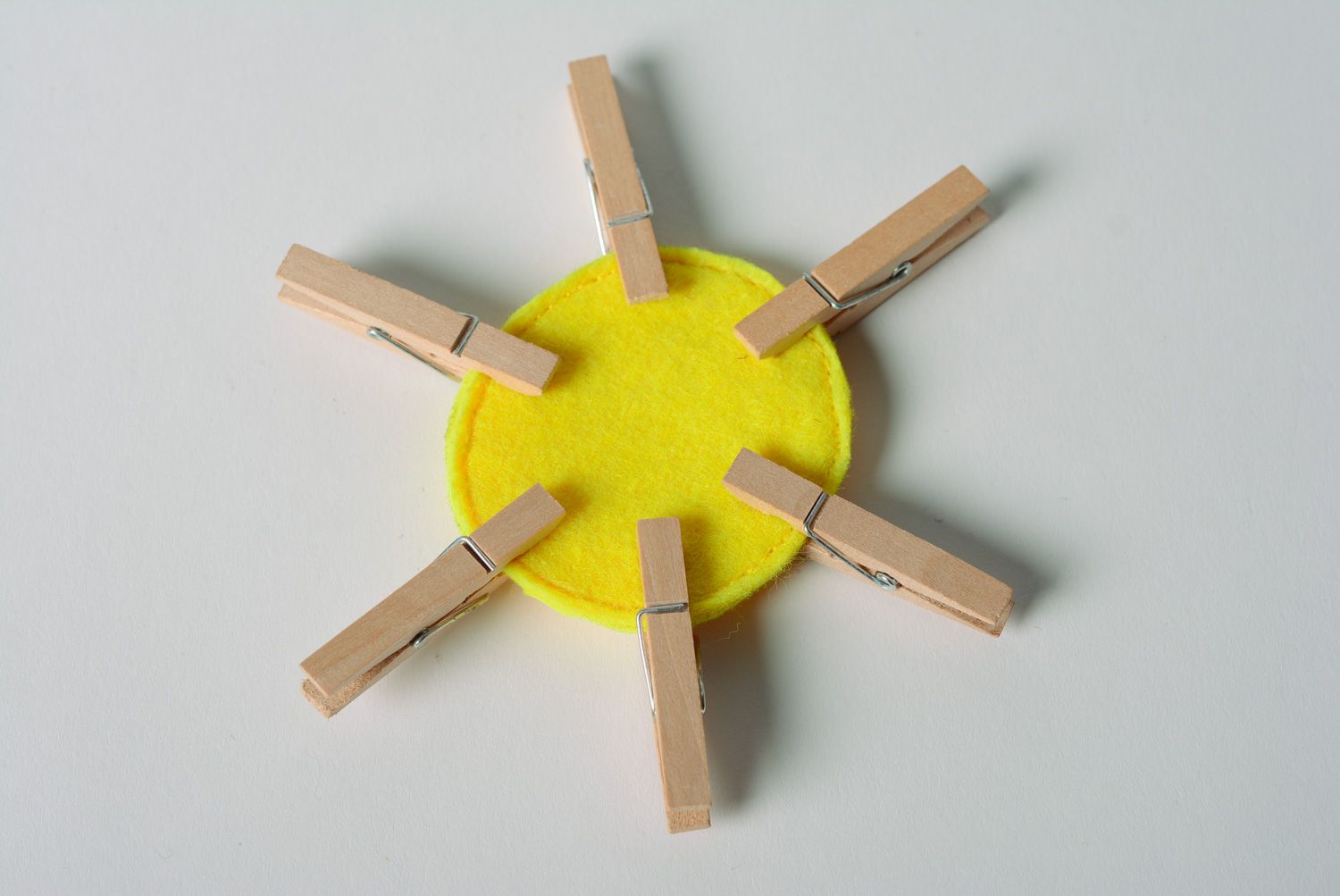 Bright yellow handmade educational toy sewn of felt with clothes pins Sun photo 2