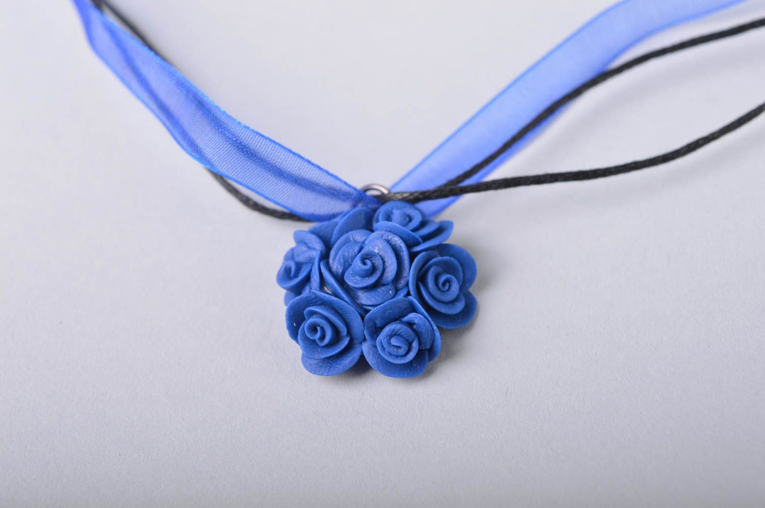 Handmade small floral deep blue cold porcelain pendant on ribbon and cord photo 3