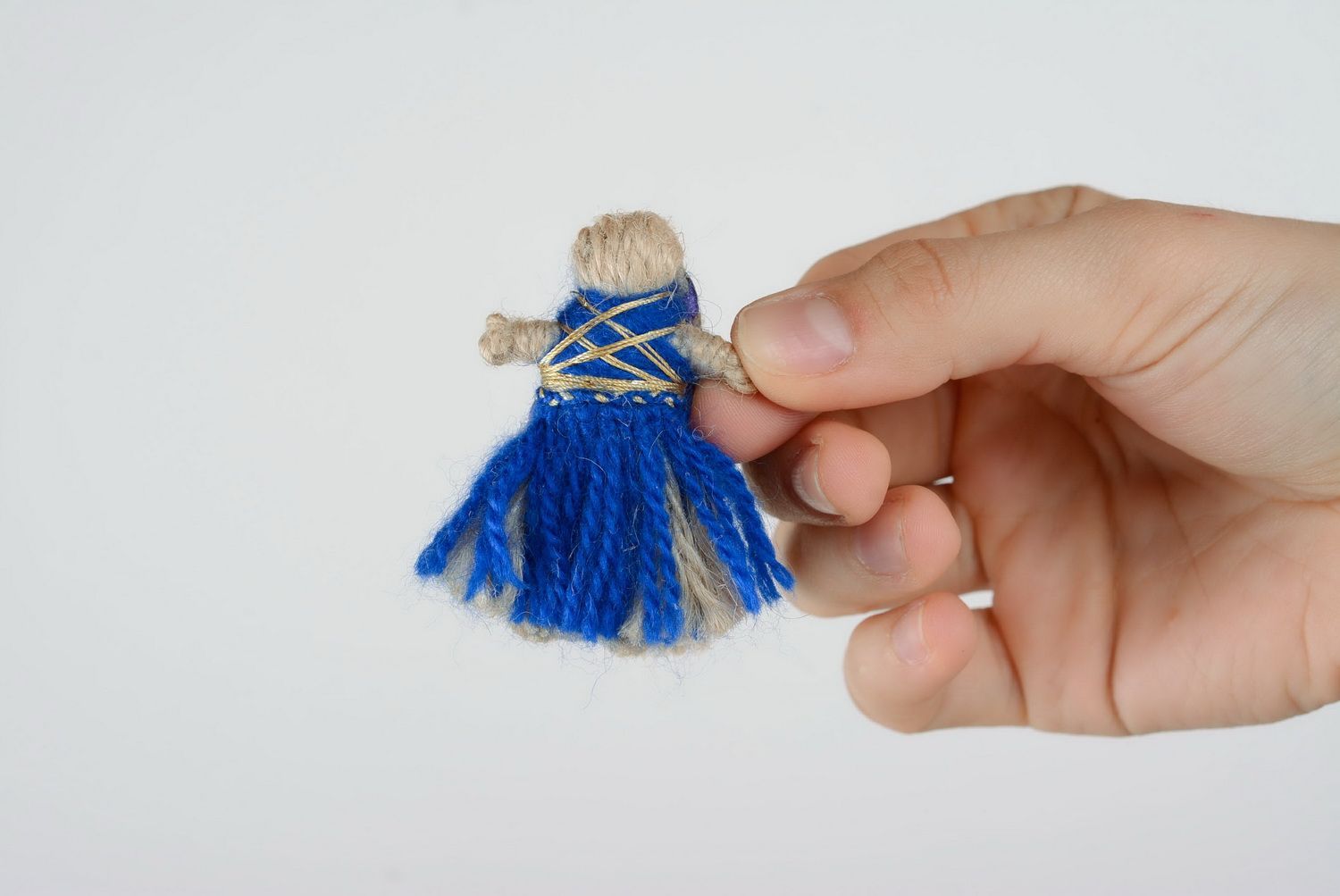 Muñeca de trapo de souvenir de cordón natural foto 1
