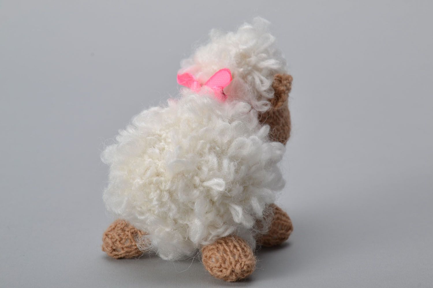 Knitted toy in the shape of a small sheep photo 4
