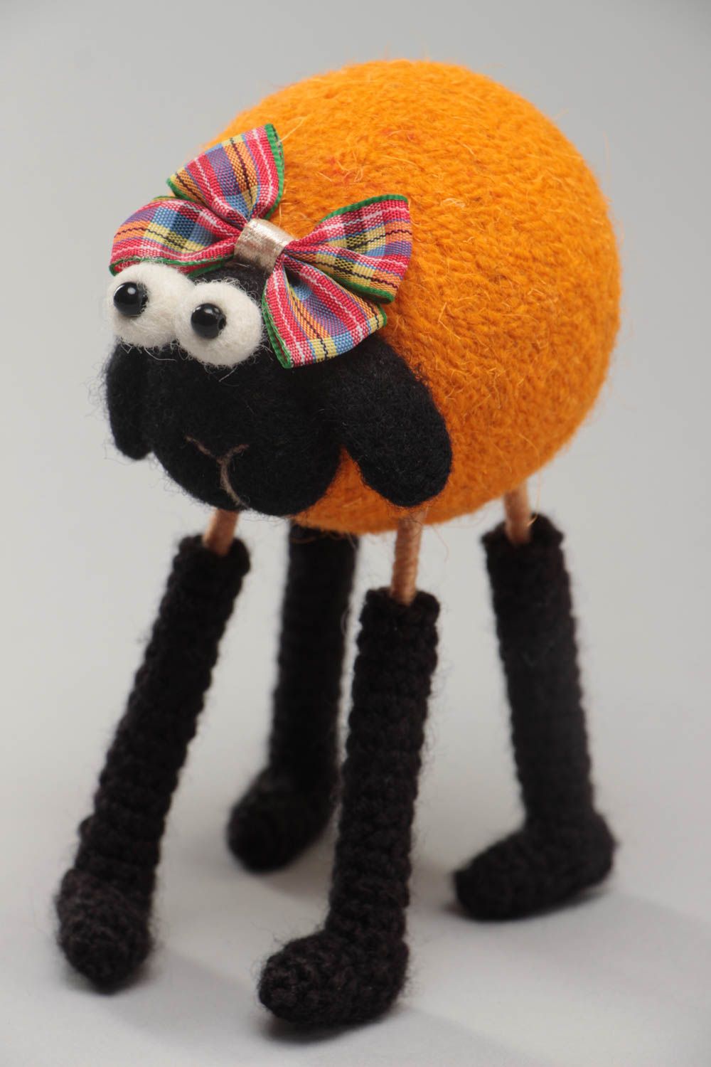 Handmade funny soft toy crocheted and felted of wool orange lamb on wooden paws photo 2