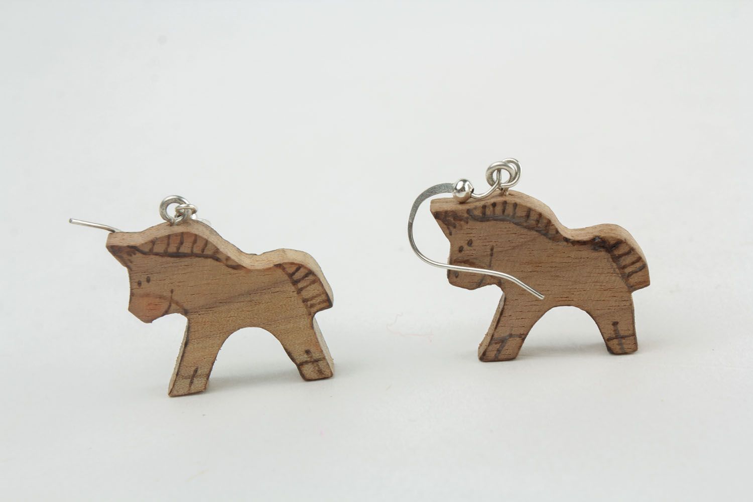 Wooden earrings in the shape of horses photo 3