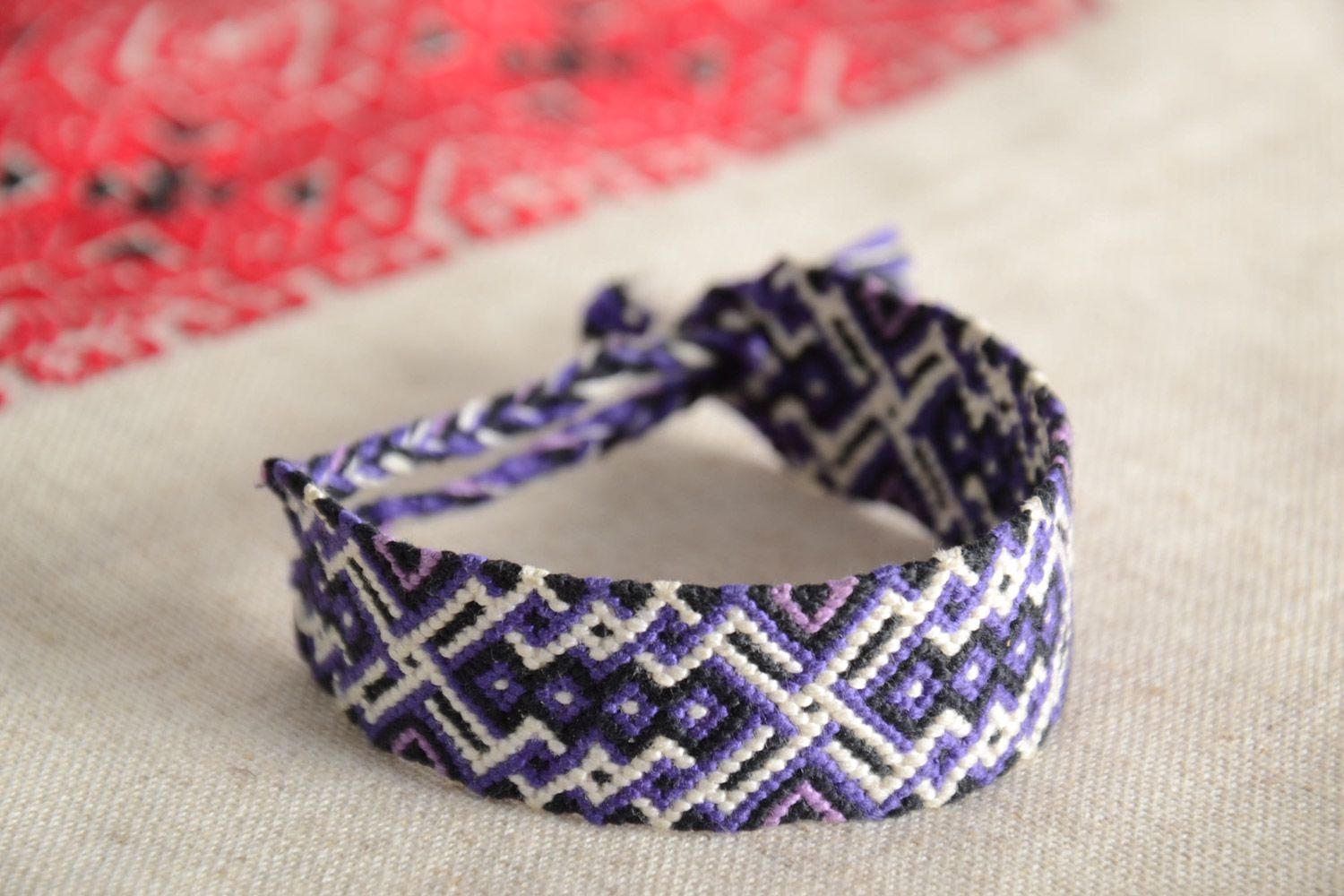 Handmade friendship wrist bracelet woven of threads in ethnic style unisex photo 1