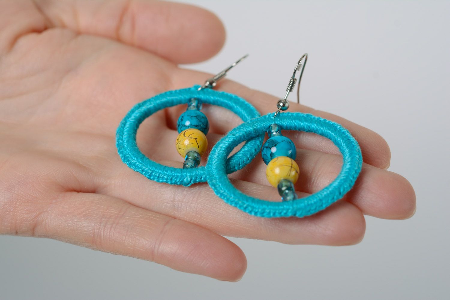 Handmade ring-shaped earrings with beads crocheted over with cotton threads photo 2