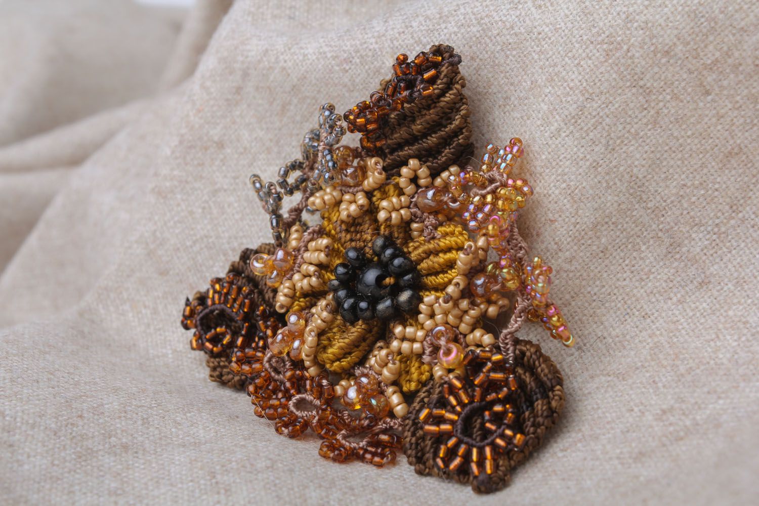 Beautiful brooch made of threads and beads photo 1