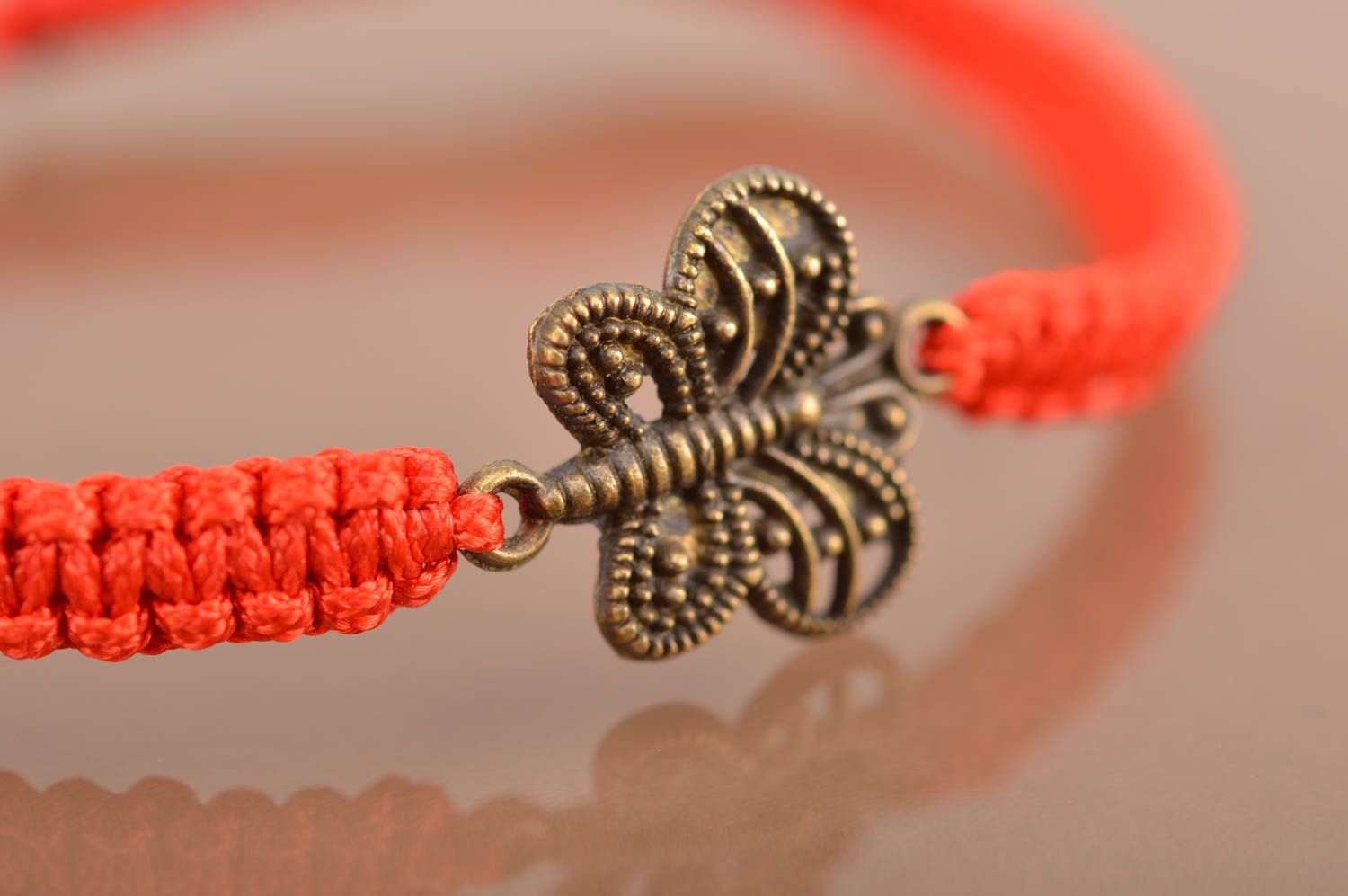 Handmade stylish red woven wrist bracelet made of threads with butterfly photo 4