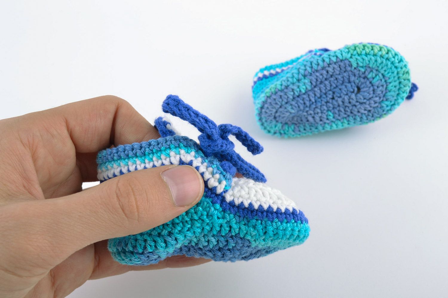 Handmade knitted wool baby booties in blue color palette photo 3