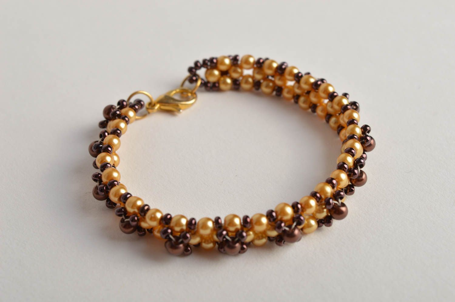 Handmade beaded bracelet in golden and brown color for girls photo 4