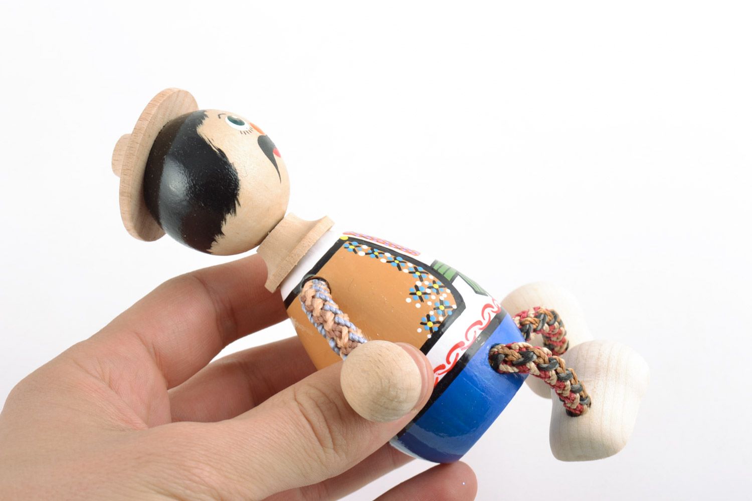 Handmade painted wooden eco toy in the shape of boy in national Ukrainian costume photo 2