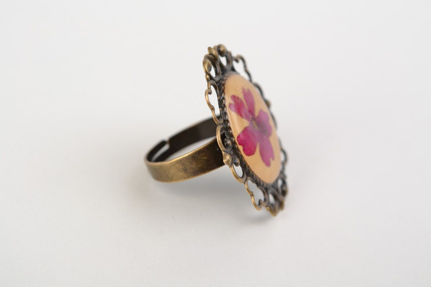 Handmade ring with vintage metal basis and real dried flower in jewelry resin  photo 5