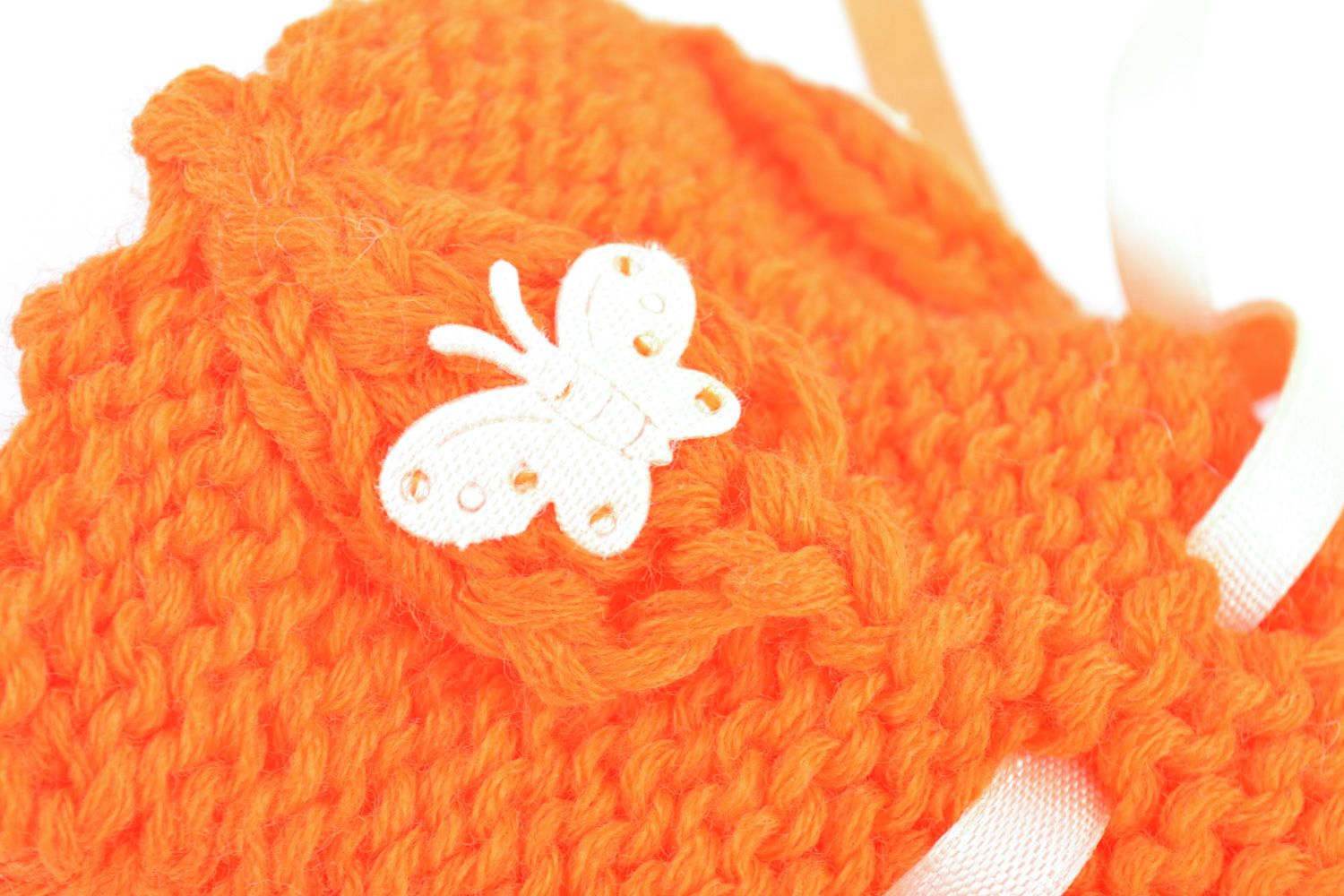 Handmade knitted wool baby bootees of orange color photo 2