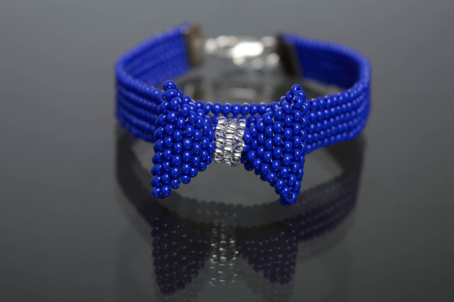 Blue handmade beaded bracelet with bow photo 1