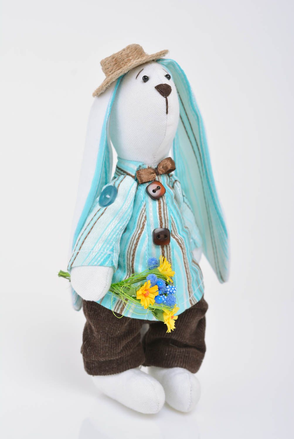 Handmade designer soft toy sewn of cotton rabbit in blue costume with bouquet photo 1