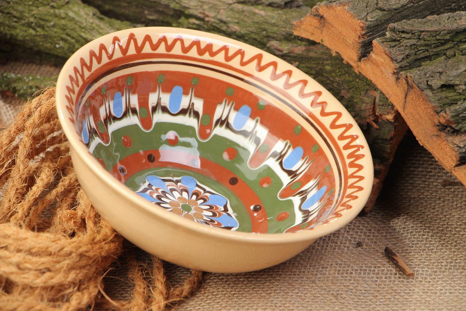Handmade beautiful deep ceramic bowl ornamented with colorful glaze for 500 ml photo 1