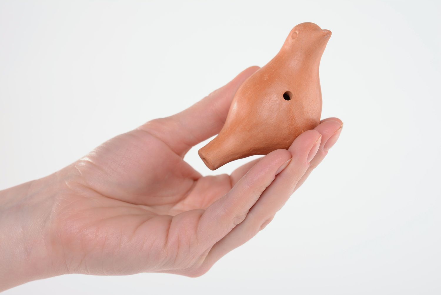 Clay penny whistle in the shape of a bird photo 5