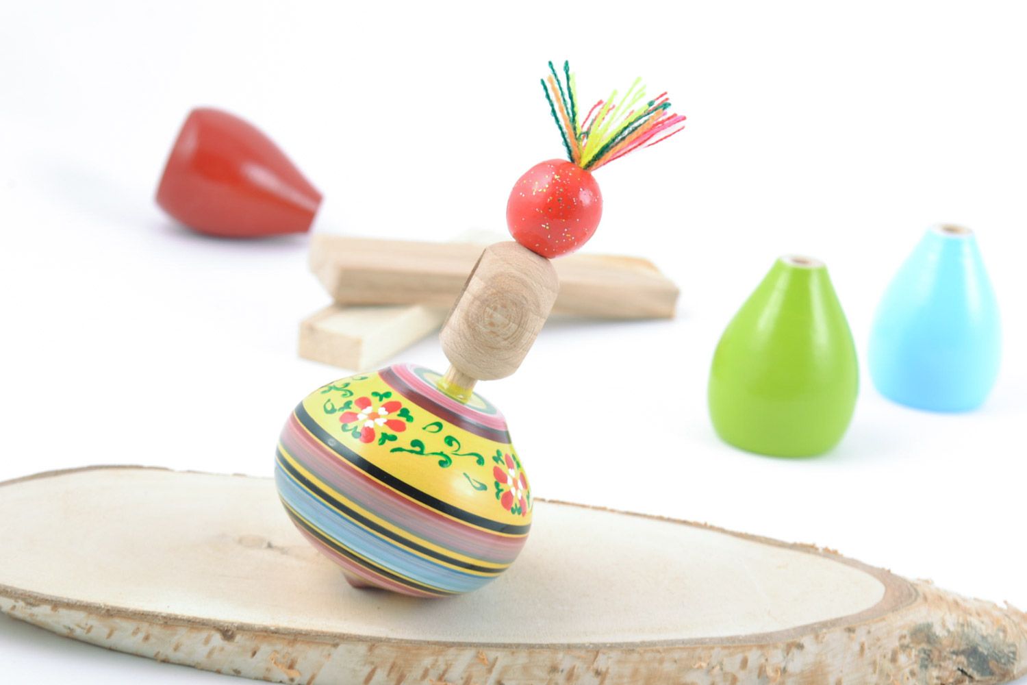 Homemade eco friendly wooden toy spinning top painted with ornaments for kids photo 1