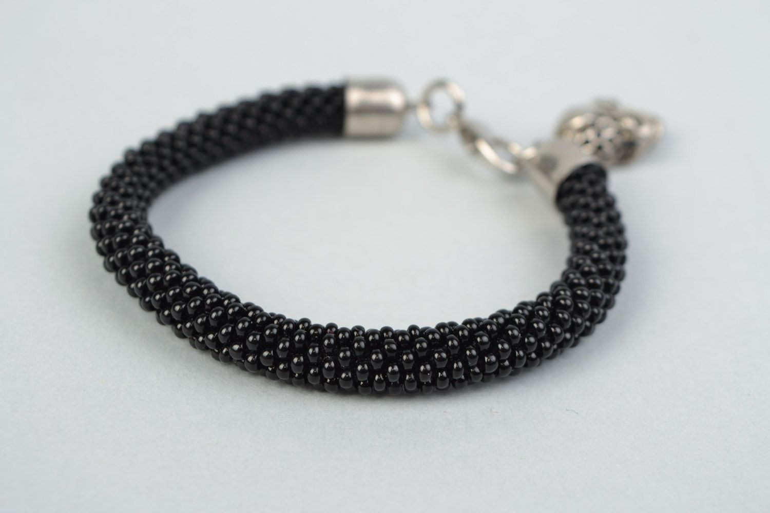 Handmade beaded cord women's wrist bracelet in black color with skull charm photo 3