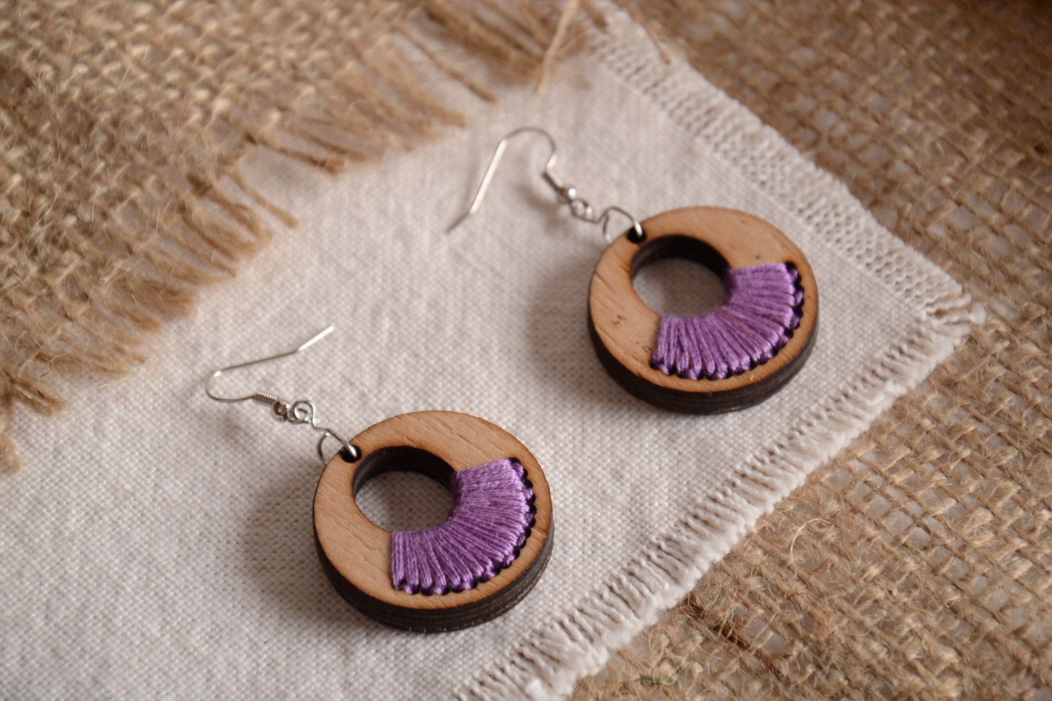 Handmade round shaped plywood earrings with purple embroidery   photo 1