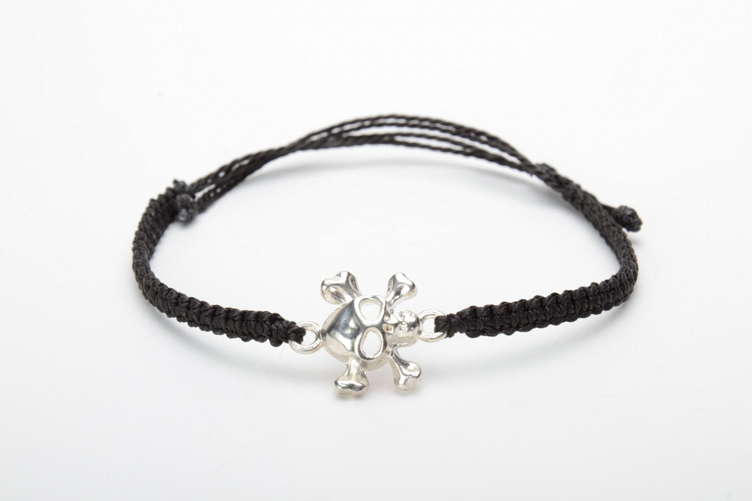 Handmade black woven capron thread wrist bracelet with metal charm in the shape of skull photo 5