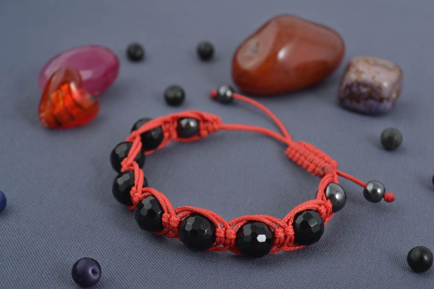 Black beads strand bracelet gemstone jewelry on red card photo 1