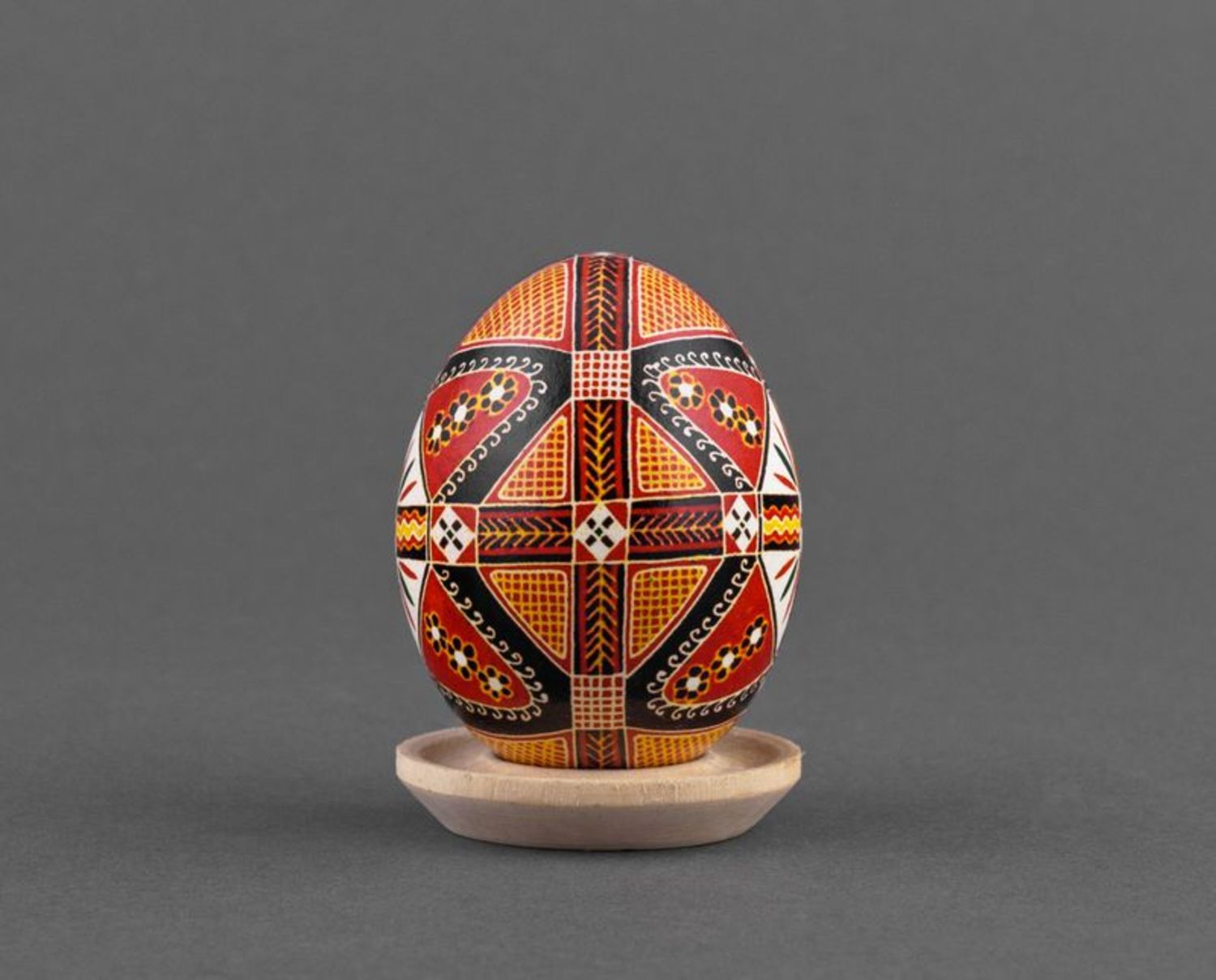 Painted Easter egg with colorful ornaments in ethnic style for present photo 2