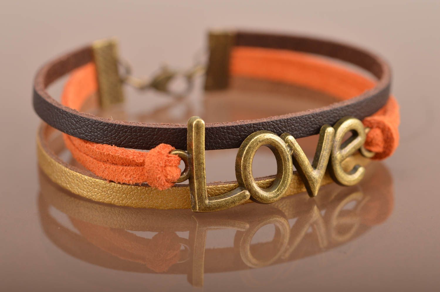Unusual beautiful orange bracelet woven of suede cords with inserts Love photo 2