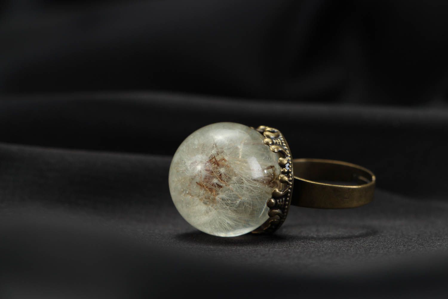 Ring with a natural dandelion coated with jewelry resin photo 3